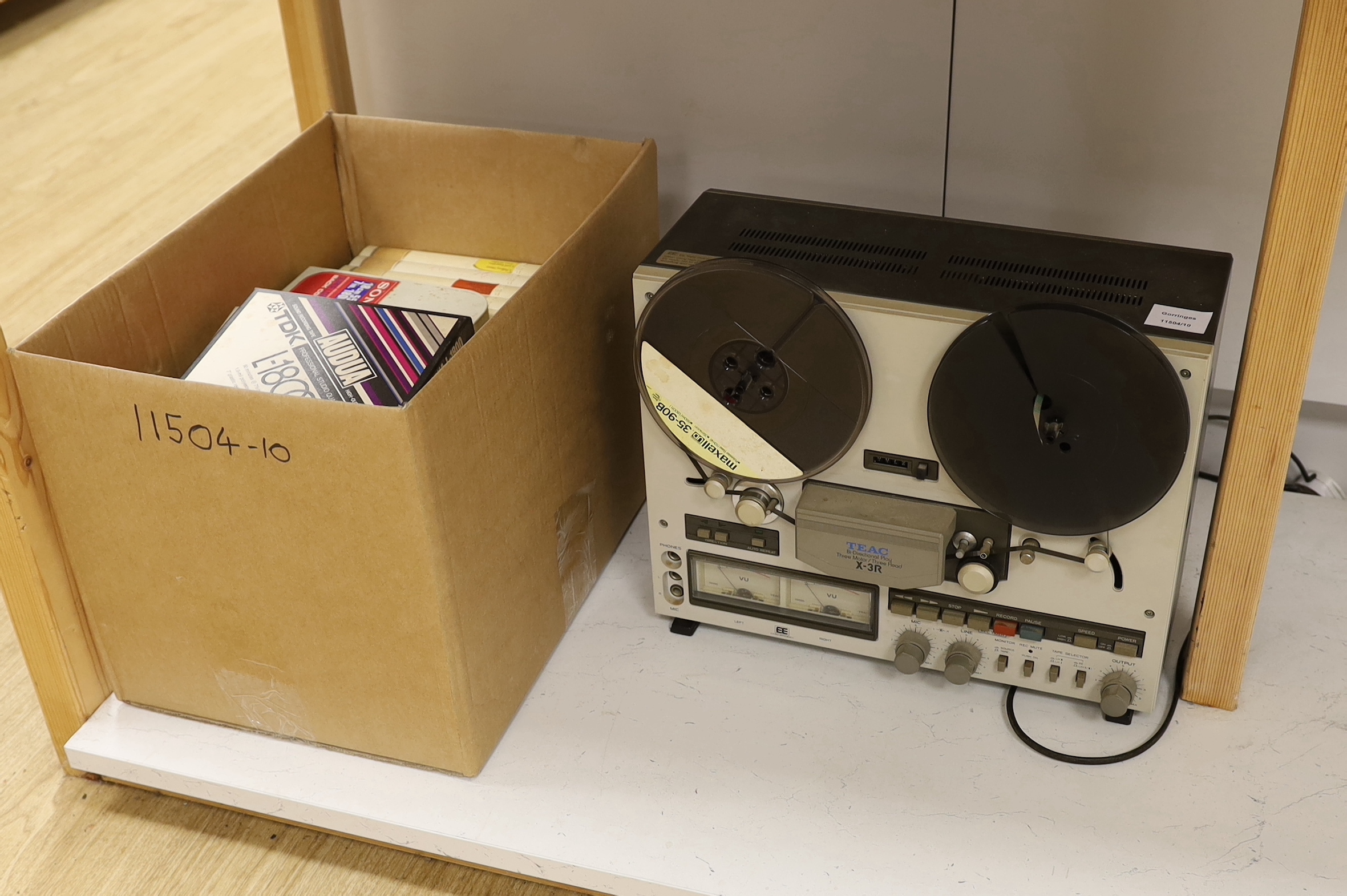 A TEAC X-3R reel to reel player, together with a collection of cased reels